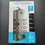 Belkin 12-OUTLET Pivot-plug Power Strip Surge Protector W/ 8-FOOT Cord Nip. Fixed Price $24.99.