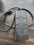 Insignia 8-OUTLET Surge Protector (NS-HW503-C). Fixed Price $15.00.