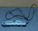 Rocketfish 7-OUTLET Surge Protector Strip, RF-AVS7ES. Fixed Price $12.00.