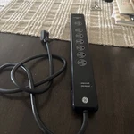 Protected 7-OUTLET 2-USB Power Strip Surge Protector, 4FT. Cord. Fixed Price $15.00.